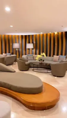 a large living room with couches and a table at Shore Residence D11 Shortwalk Mall Of Asia/ In't Airport in Manila