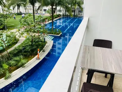 a view of the pool from the balcony of a resort at Shore Residence D11 Shortwalk Mall Of Asia/ In't Airport in Manila
