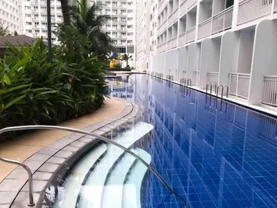 a large swimming pool in a large building at Shore Residence D12 Near Airport- SM Mall Of Asia in Manila