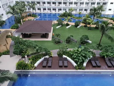 a view of a resort with a swimming pool at Shore Residences MOA Staycation in Manila