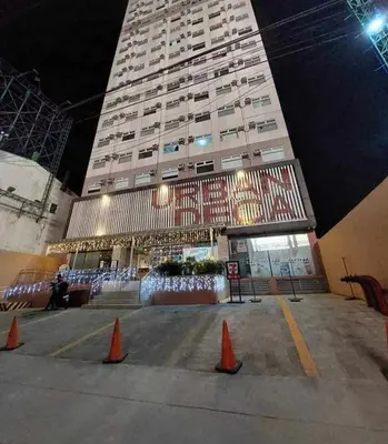 a large building with orange cones in front of it at JJMC HOMESTAY 22 With netflix and fast wifi in Manila