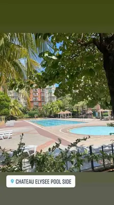 a view of a swimming pool in a resort at Borbon's Condo Suite in Manila