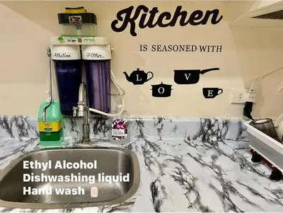 a kitchen with a sink and a counter top at Borbon's Condo Suite in Manila