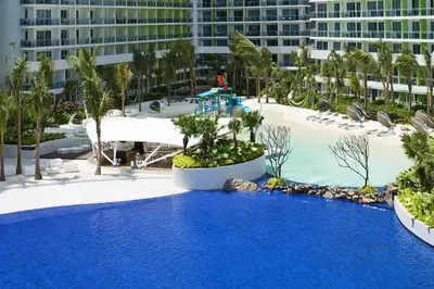 a large pool with blue water in a resort at Azure Urban Residence A10 Near Airport and SM Bicutan+ Free wifi in Manila
