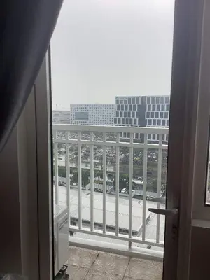 a view of a building from a window at Condo- tel for At Mall of Asia Philippines in Manila