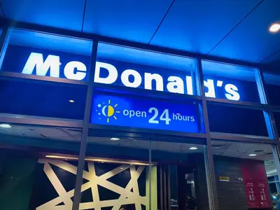 a sign on the side of a mcdonalds restaurant at Morgan Suite BGC shortwalk1 Venice Mall free pool in Manila