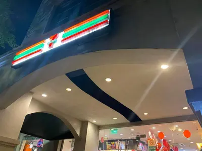 a store with a neon sign on the ceiling at Morgan Suite BGC shortwalk1 Venice Mall free pool in Manila
