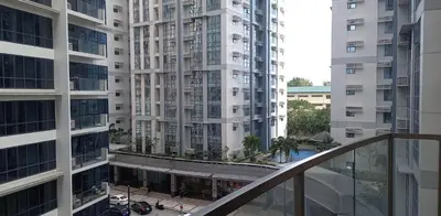 a view from the balcony of a tall building at Morgan Suite BGC Shortwalk3 Venice Mall free pool gym in Manila