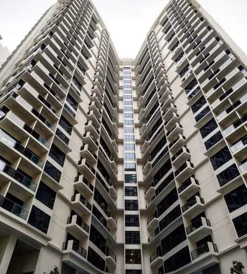 a large apartment building with balconies at Morgan Suite BGC Shortwalk3 Venice Mall free pool gym in Manila