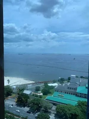 an aerial view of a city and the ocean at Comfy Condo Grand Riviera Suite, Roxas Blvd Ermita Manila infront of US Embassy in Manila