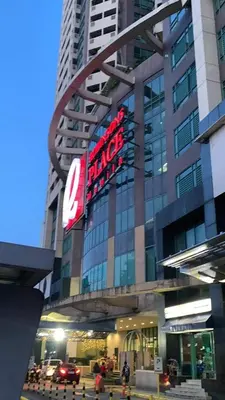 a large building with a large sign on it at Comfy Condo Grand Riviera Suite, Roxas Blvd Ermita Manila infront of US Embassy in Manila