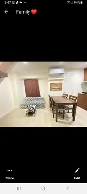 a picture of a living room with a table and chairs at VICTORIA DE MAKATI Two (2) Bedroom Up and Down Condo in Manila