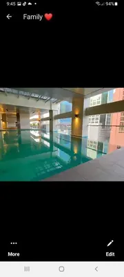 a picture of a building with a swimming pool at VICTORIA DE MAKATI Two (2) Bedroom Up and Down Condo in Manila