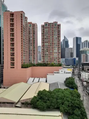 a view of a city skyline with tall buildings at VICTORIA DE MAKATI Two (2) Bedroom Up and Down Condo in Manila
