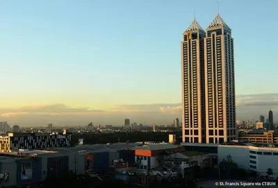 a view of a city with a tall building at Relaxing Big Studio Bedroom in Manila