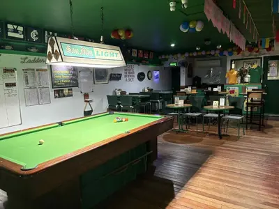 a billiard room with a pool table in a restaurant at duck inn manila in Manila