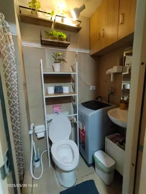a small bathroom with a toilet and a sink at 821 Field Res Condo by Bambie with 2 wifi in Manila