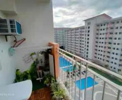 a balcony with a view of a building at 821 Field Res Condo by Bambie with 2 wifi in Manila