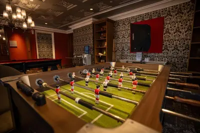 a game room with a football game on a table at Elite Pod at Knightsbridge Residences Makati in Manila