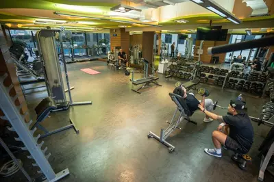 a group of people in a gym doing weights at Elite Pod at Knightsbridge Residences Makati in Manila