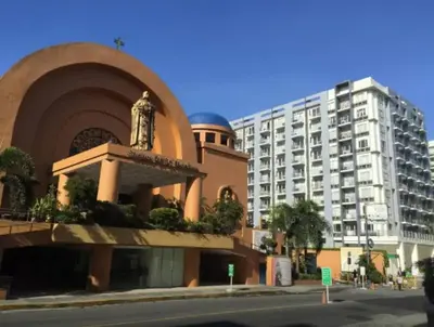 a large building next to a large apartment building at 2 BR Condo Apartment near NAIA 3 Pasay City in Manila