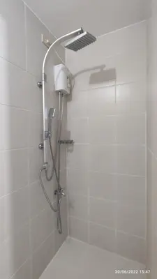 a shower with a shower head in a bathroom at Destina Stays @Jazz Residences, Makati, Metro Manila, w/Netflix in Manila