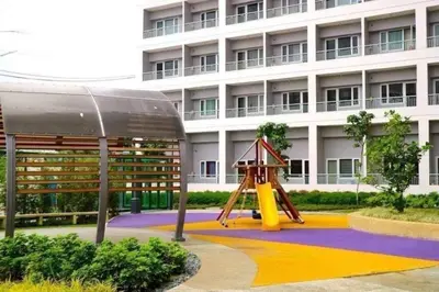 a playground in front of a building at Affordable Fully Furnished Condo Unit in Manila