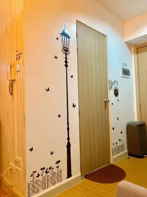 a room with a wall with a street light and birds decals at Affordable Fully Furnished Condo Unit in Manila