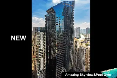 a view of a tall building in a city at Century Spire Makati in Manila