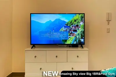 a flat screen tv sitting on top of a dresser at Century Spire Makati in Manila