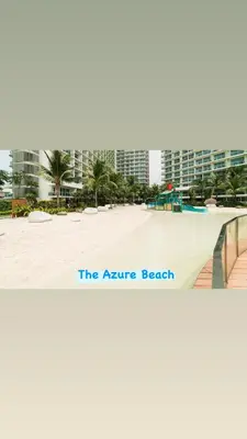 a beach with a sign that reads the nature beach at The Carribean Suites by Azure in Manila