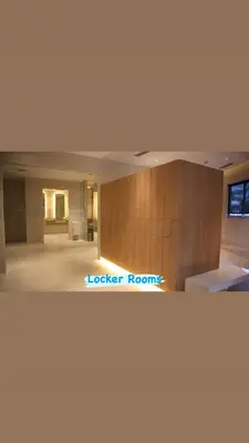 a large room with a bed and a desk at The Carribean Suites by Azure in Manila