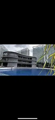 a picture of a building with buildings in the background at The Carribean Suites by Azure in Manila