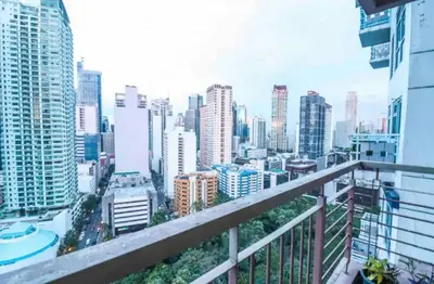 a view of a city from the balcony of a building at Sky Staycation KL Greenbelt, Isabel's Makati Rooms in Manila