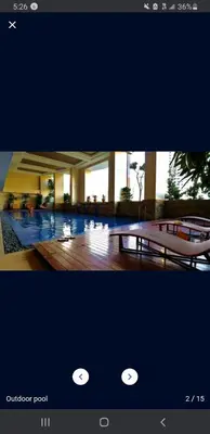 a picture of a lobby with a couch and a building at 22-A Cozy condo in KL Mosaic Residences near Greenbelt with free WIFI in Manila