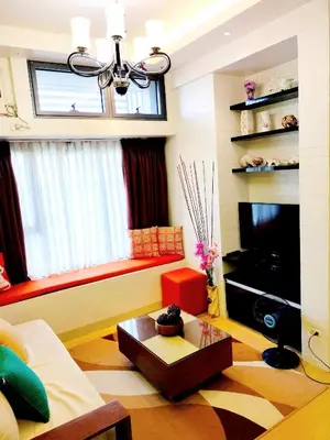 a living room with a couch and a table at The Levels 2BR Condo Fully Interior Cosmo Living in Manila