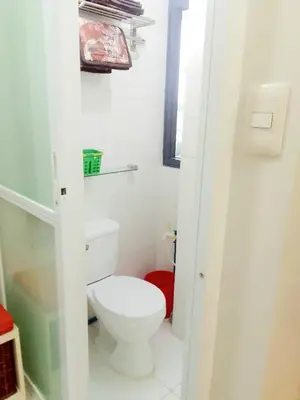 a bathroom with a white toilet in a room at The Levels 2BR Condo Fully Interior Cosmo Living in Manila