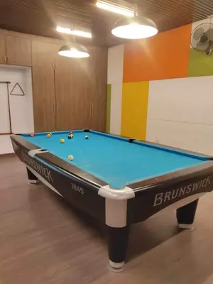 a pool table in a room with at Lancris Residences 2 Bedroom Entire Apartment near Airport with Pool in Manila