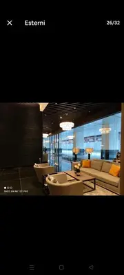 a living room with a couch and chairs and a table at Amazing view Makati Elegant flat 400MB internet in Manila