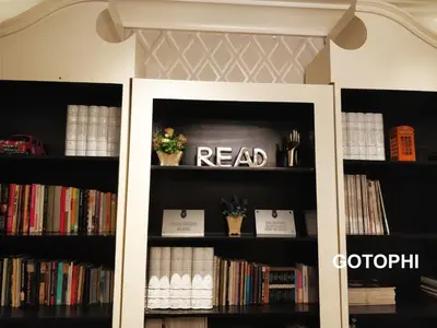 a book shelf with books and a read sign on it at The Knightsbridge Residences in Manila