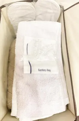 a box of white towels with a saturday eggs sign on it at Fully furnished condo in Quezon City in Manila