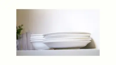 a stack of white bowls sitting on a shelf at Hive Manila Guesthouse and Apartments 400 Mbps - Gallery Studio in Bacoor