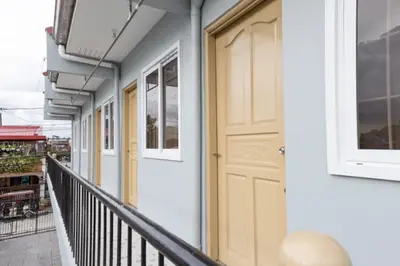 a door on the side of a building at Hive Manila Guesthouse and Apartments 400 Mbps - Gallery Studio in Bacoor