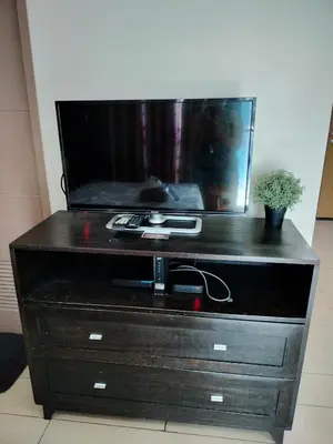 a dresser with a fish tank on top of it at Condotel Pasay Newport Near Airport in Manila
