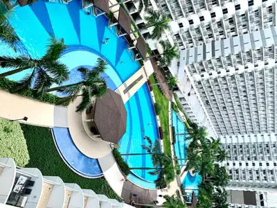 an overhead view of a large building with a swimming pool at Kathys crib 32sqm Condo Shell Residences in Manila