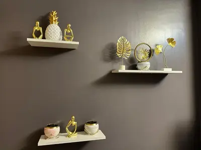 two shelves with vases and plants on a wall at Kathys crib 32sqm Condo Shell Residences in Manila