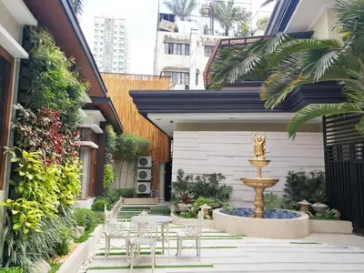 a courtyard with a fountain in a building at Adria Residences - Sapphire Garden - 2 Bedroom for 4 person in Manila