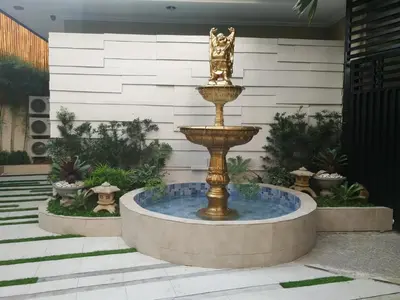 a fountain in the middle of a courtyard at Adria Residences - Sapphire Garden - 2 Bedroom for 4 person in Manila