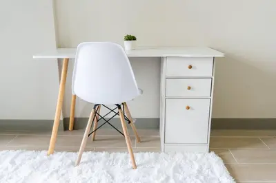 a white desk with a white chair next to a dresser at A2J Luxury 3BR Uptown Balcony BGC Suite Near Mall in Manila