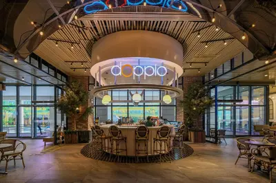 a restaurant with a table in the middle of a building at Uptown Parksuites Modern Room in Manila
